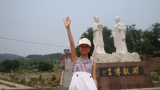Traditional Chinese temple architecture against mountain backdrop in Xintai, Shandong Province