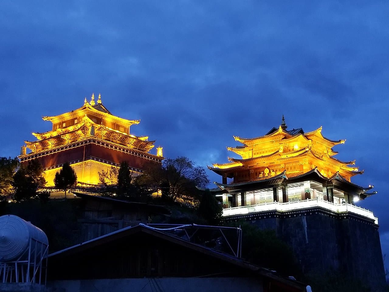 Traditional Chinese temple architecture of Guishan Temple against mountain backdrop